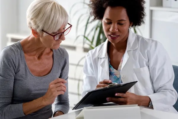 A clinician reviewing information with a patient