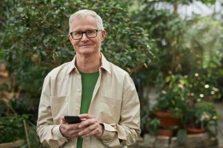 Person standing outside on their phone